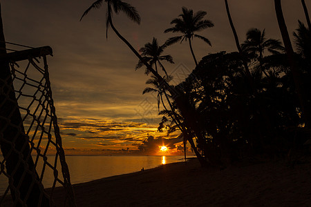 斐济斐济岛Tambua沙滩多彩的日出乐园比基尼地景冷泉旅游业橙子游客自然界基因图片