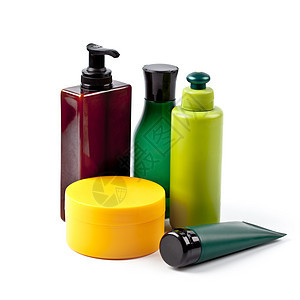 在白色背景上隔离的浴缸化妆品身体瓶子黄色洗发水浴室奶油产品团体绿色温泉图片