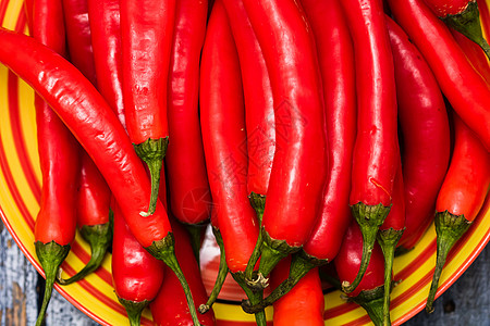 炽热的辣椒起来 红辣椒的背景胡椒厨房食物香肠燃烧香料调味品寒冷植物蔬菜图片