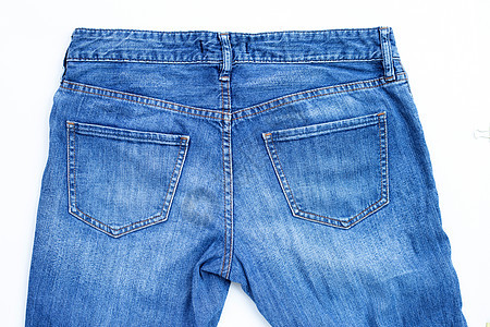 蓝色牛仔裤在白色背景上被孤立青少年店铺收藏靛青纺织品织物牛仔布折叠材料服装图片