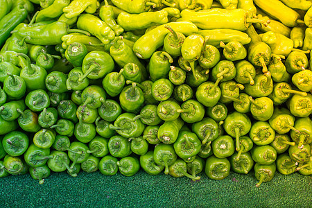 大量绿辣椒作为食物背景蔬菜植物调味品烹饪宏观红色墙纸胡椒香料美食图片