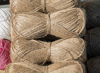 棕色线条串的滑块或卷螺纹卷轴静物解雇环形材料绳索亚麻纺织品图片