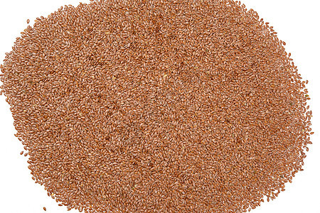 棕褐色干麻叶种子的纹理 顶视图宏观棕色粮食亚麻纤维食物营养谷物白色背景图片