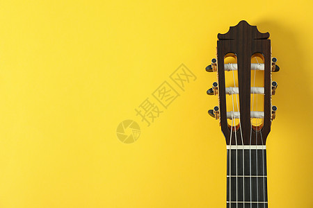 黄色背景的吉他脖子 文字空间娱乐工作室考试音乐会指板演员岩石艺术乐器音乐背景图片