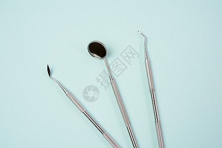 蓝底牙医的金属医学物品 表1矫正刮刀乐器药品牙齿卫生医疗镜子保健工具图片