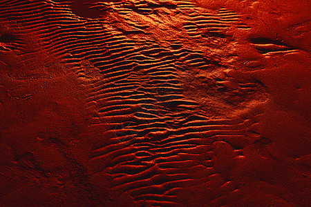 湿沙背景纹理中的涟漪海岸海洋岩石海滩海浪海岸线白色棕色沙丘波纹图片