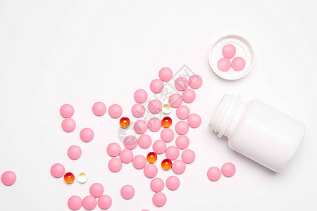 白罐子 有药丸 在浅底背景最直观的药物健康维他命医疗治疗治愈抗生素帮助剂量药品药剂红色宏观图片