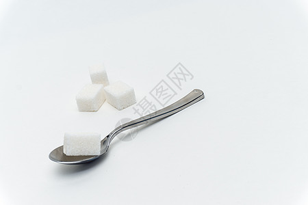 每茶匙卡路里糖糖基方糖每茶水龙口热量的糖立方糖糖果白色化合物摄影颗粒状碳水添加剂食物宏观蔗糖图片