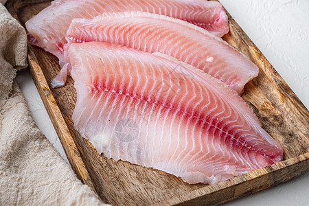 白底的蒂拉皮亚鱼片肉海鲜粉色白鱼图片