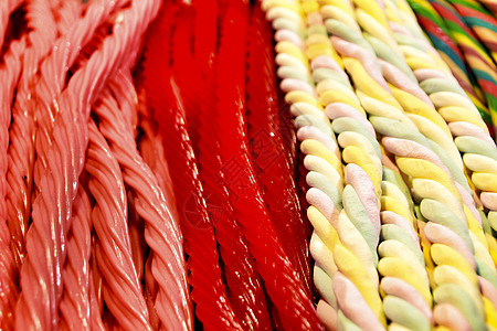 街摊里有各种颜色和口味的糖果葡萄糖棉花食物生日花絮娱乐可乐小吃派对饮食图片