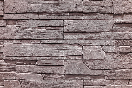 墙是由多层天然石制成的 是建房子用的石头砂浆褪色风化平板岩石石材石板乡村材料阴影图片