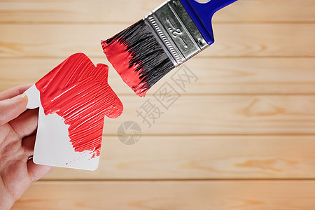 修复房屋装修油漆家装 绘画工作房子图标装修房屋建筑模型 新房改造翻新油漆更新家园 在红色颜色的标志房子画笔图片