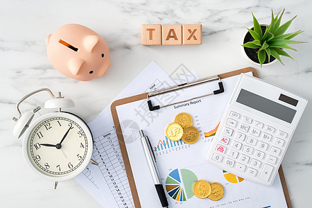 在大理石白桌上最顶尖的计算和支付税概念商业植物储蓄平铺季节计算器工作统计金融图表图片