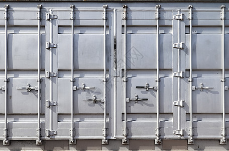 银色货物容器上金属和钢表面的详细特写视图抛光街道墙纸城市拉丝雇用艺术材料盘子控制板图片