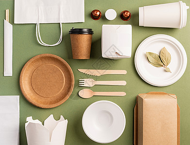 绿色背景下的环保一次性餐具厨具浪费生物纸板回收竹子材料工艺产品勺子图片