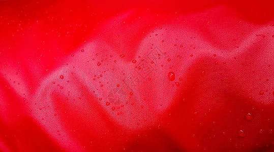 具有防水效果的红色纺织品上的大水滴 防水浸渍 织物上的纹理滴落液体材料气泡宏观季节墙纸雨滴帐篷尼龙环境图片