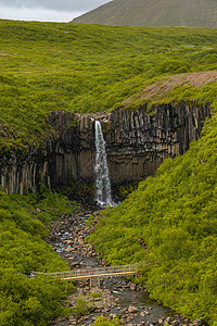 冰岛南部有黑色的玄武柱柱 高得惊人的高斯瓦尔蒂弗斯瀑布瀑布吸引力场景黑柱冒险火山戏剧性悬崖瀑布环境岩石图片