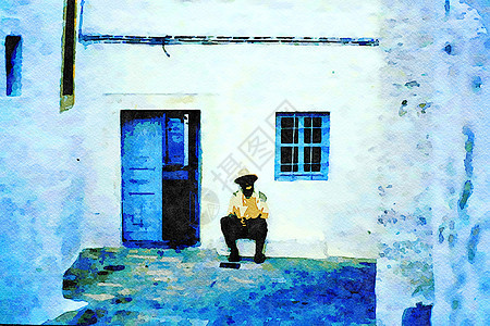 一个男人在希腊岛上一个村庄的小房子的露台树荫下放松图片