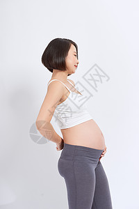 患有背痛的孕妇疼痛父母妈妈成人女士母亲婴儿女性按摩肚子背景图片
