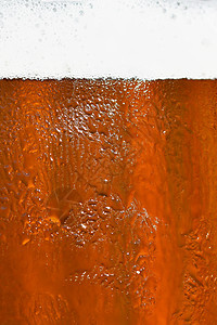啤酒 啤酒杯的美丽细节与泡沫 抽象彩色背景酒精酒吧啤酒厂液体宏观酿造饮料金子草稿玻璃图片