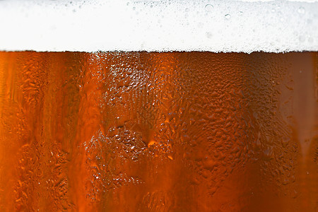 啤酒 啤酒杯的美丽细节与泡沫 抽象彩色背景气泡金子玻璃宏观酿造液体酒吧口渴饮料酒精图片