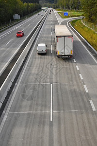 高速公路上交通堵塞的汽车大街运动旅行速度场景小时车辆日落商业蓝色图片