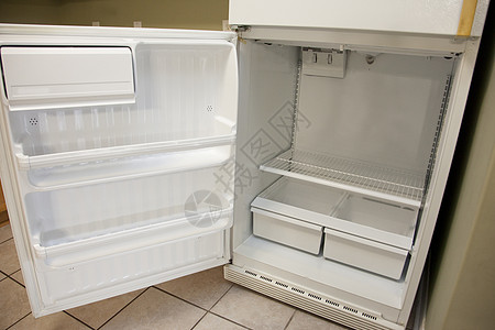 开放空冰箱货架厨房冻结架子饮食损失贫困器具抽屉食物图片
