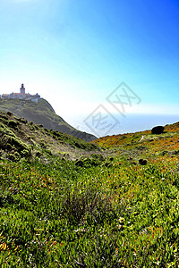 葡萄牙灯塔周围的草地导航海岸卡波场景石头旅游岩石悬崖地标海洋图片