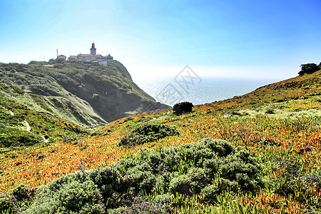 葡萄牙灯塔周围的草地蓝色旅行果肉支撑海洋石头卡波悬崖风口浪尖地平线图片