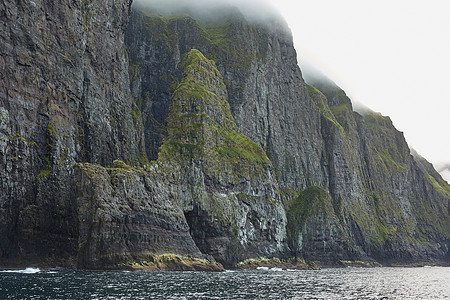 丹麦法罗群岛野生和岩石海岸旅行海洋土地沉积物风景天空国家悬崖荒野戏剧性图片