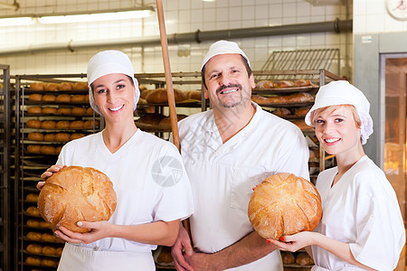 贝克和他的团队在面包店味道工作职业馒头店铺男性生产手工老板工作服图片