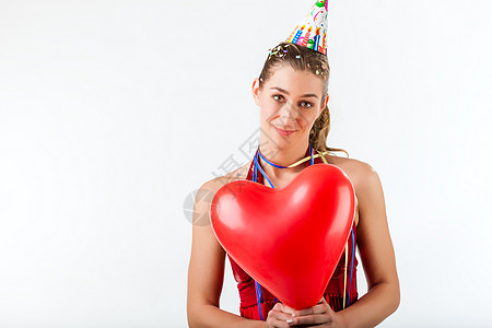 妇女庆祝生日或情人节的庆祝活动女孩新年微笑乐趣气球纸屑纪念日飘带幸福喜悦图片