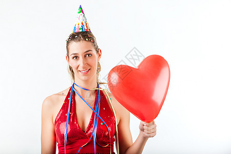 妇女庆祝生日或情人节的庆祝活动气球乐趣纸屑女孩飘带欲望幸福微笑流光喜悦图片