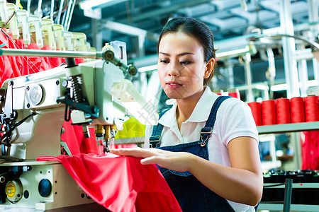 中国一家纺织厂的裁缝女工女士质量工作工厂衣服职业棉线织物员工工人图片