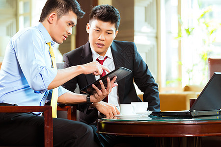 中国商务人士在旅馆举行的商务会议上的生意会议工作咖啡冒险笔记本人士门厅职业大堂办公室经理图片