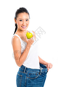 亚裔妇女饮食减体重女士身体水果裤子人们停留运动装女性健康青年图片