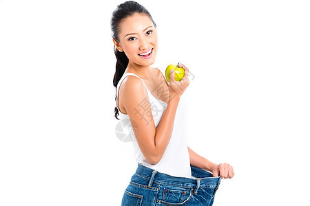 亚裔妇女饮食减体重停留水果人们健康运动裤子身体女性女士牛仔裤图片