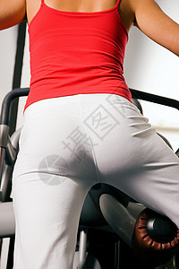 在健身房工作的妇女运动举重身体反抗闲暇重量俱乐部数字锻炼健身图片