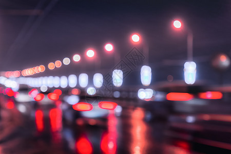 汽车和灯笼的闪亮灯光照耀着夜间城市湿沥青背景场景路灯运动运输交通反射景观街道耀斑图片