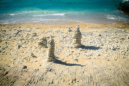 海滩上的石头堆平衡冥想自由温泉享受旅游团体精神卵石岩石图片