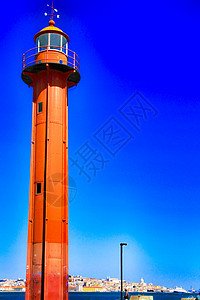 里斯本阿尔马达村港红灯塔Redhouse海岸天空反射灯塔港口海洋安全地标建筑学房子图片