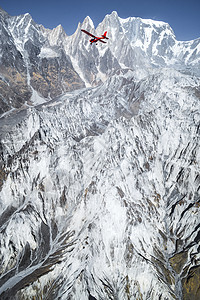 超轻型飞机飞越Pokhara和Annapurna地区上空降落伞蓝色航空三轮车天空风险空气飞机运动跳伞图片