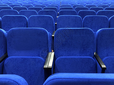 蓝色椅子在一个空的音乐厅里 电影院里的空排图片
