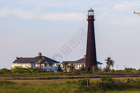 玻利瓦尔点灯塔灯塔蓝色海滩天空日落旅行城市海洋建筑学全景图片