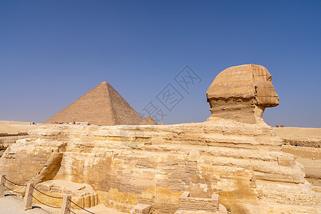 吉萨的伟大斯芬克斯人面狮身地标纪念碑遗产石头游客沙漠废墟金字塔图片