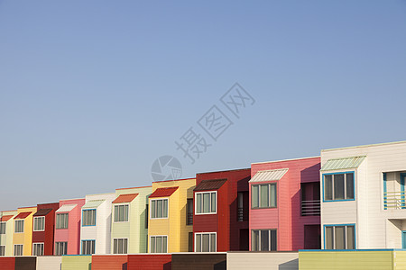 加尔维斯顿海滩旁的多彩公寓天际街道城市日落市中心码头海滩天空景观海洋图片