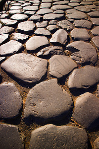 古老的石头路材料意义城市地板建筑学人行道感觉嘎嘎颗粒状背景图片