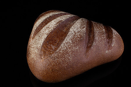 暗黑背景的面包 Loaf营养糕点饮食面包师种子早餐粮食脆皮团体金子图片