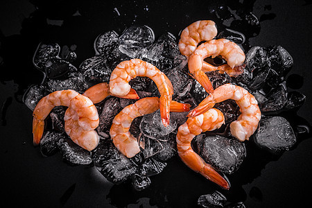 冰雪的冲刺尾巴海洋食物营养贝类海鲜团体黑色背景图片