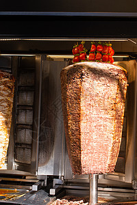 土耳其传统烹饪街食物的土裔捐赠者牛肉午餐厨师餐厅美食旋转火鸡火焰厨房图片